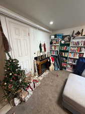 Living area with carpet floors & fireplace
