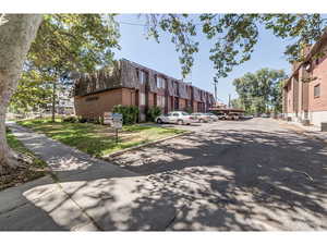 View of asphalt street with sidewalks and curbs