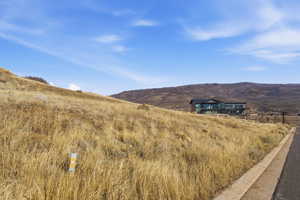 View of mountain background featuring rural landscape