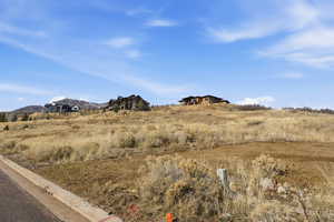 View of mountain backdrop with rural landscape