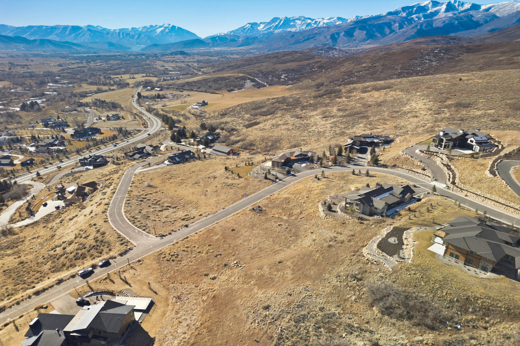 Aerial perspective of suburban area with a mountainous background
