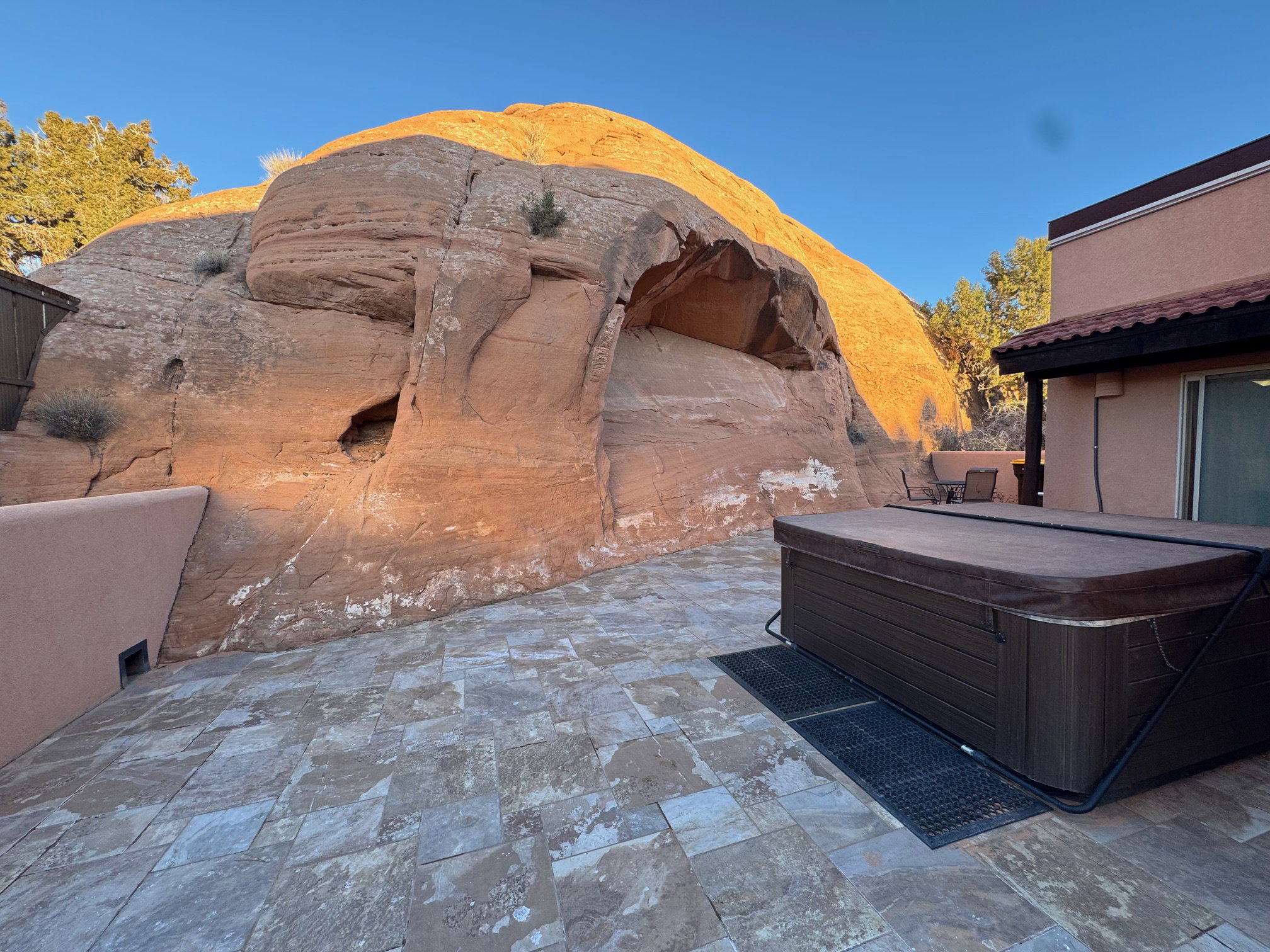 View of patio / terrace with a hot tub