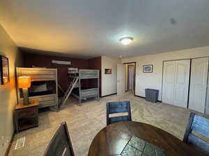 Unfurnished bedroom featuring carpet floors and a closet