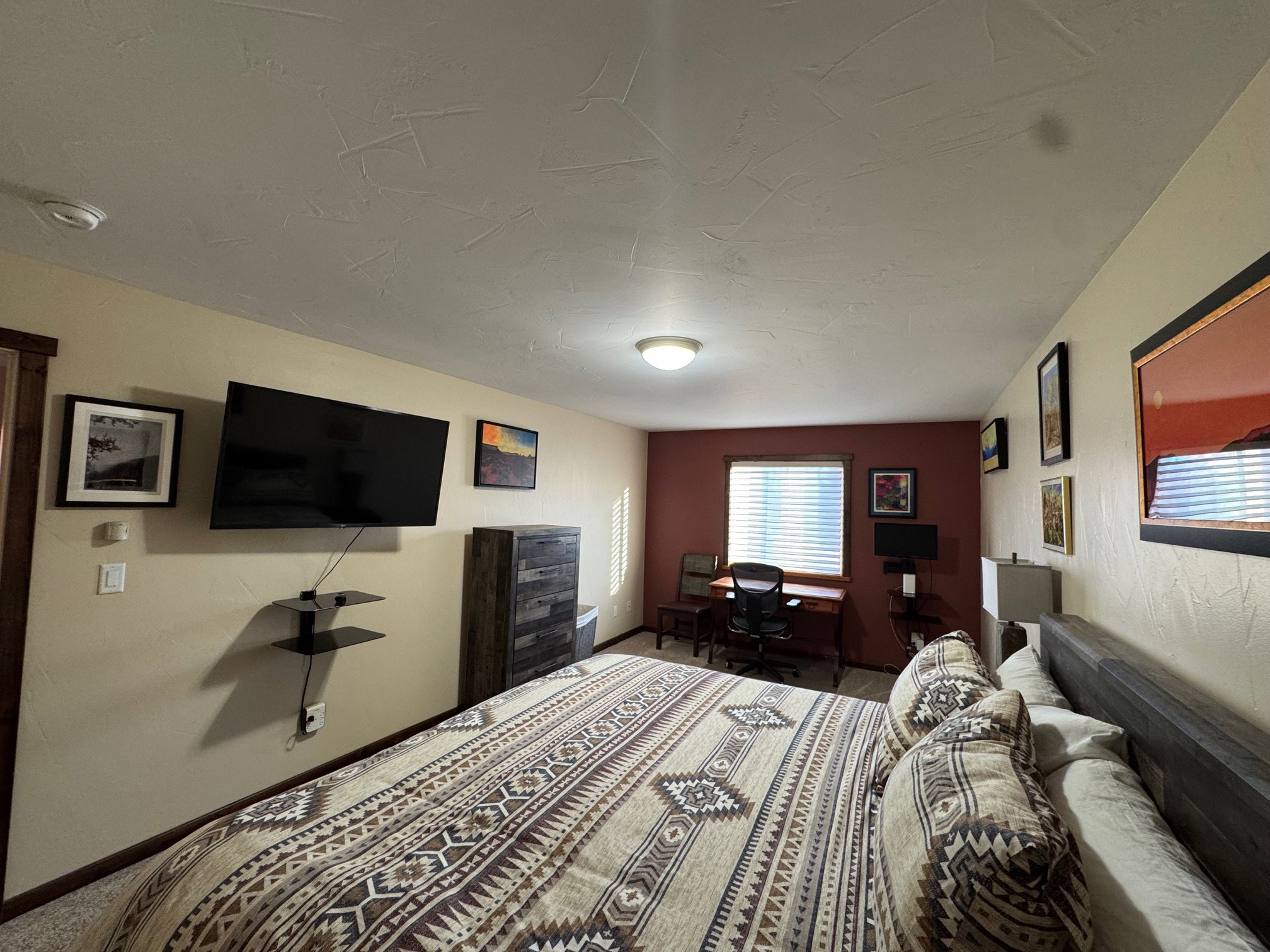 Carpeted bedroom featuring baseboards