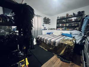 Bedroom featuring wood finished floors