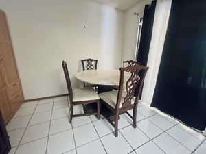 Dining room featuring light tile patterned floors