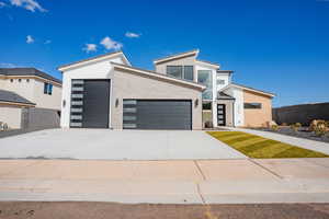 Contemporary house featuring driveway and an attached garage