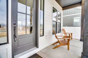 Entrance to property with a porch