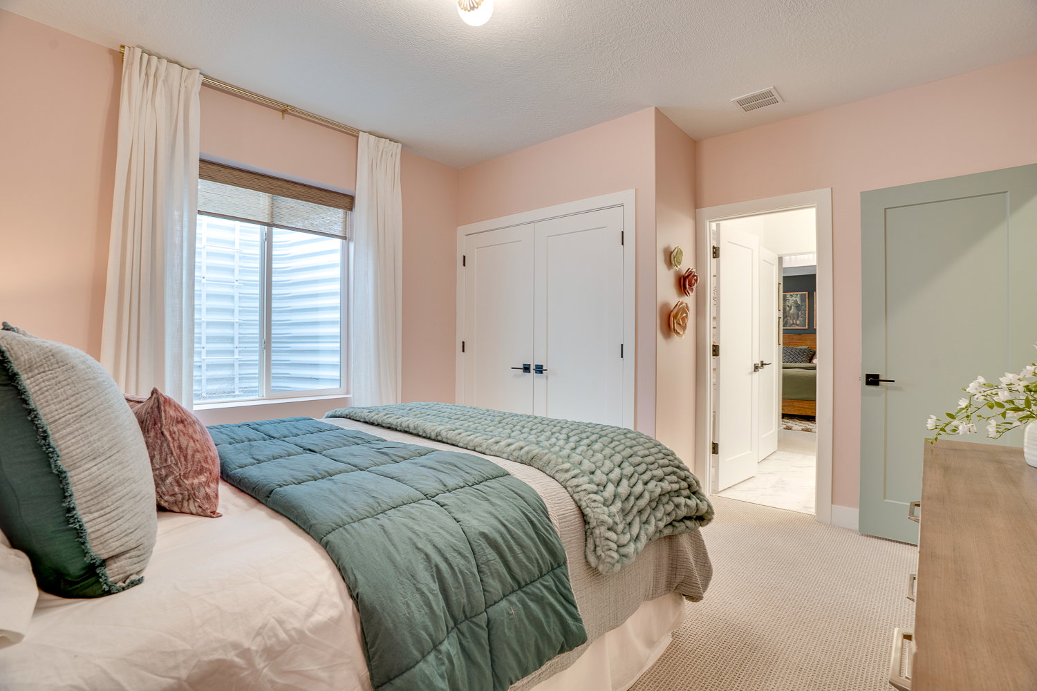 Bedroom with carpet and a closet