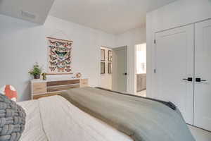 Bedroom with a closet and ensuite bathroom