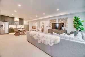 Living room featuring recessed lighting and light carpet