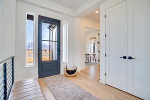 Foyer with light wood finished floors, recessed lighting, and a mountain view
