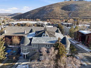 Aerial view of residential area featuring a mountainous background