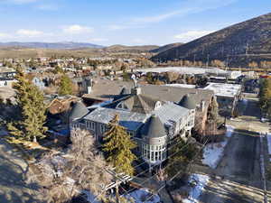 Aerial perspective of suburban area featuring a mountainous background