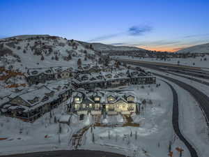 Snowy aerial view featuring a mountain view