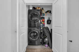 Laundry room featuring stacked washer / dryer