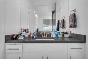 Bathroom featuring vanity and recessed lighting