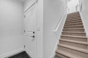 Stairs featuring baseboards