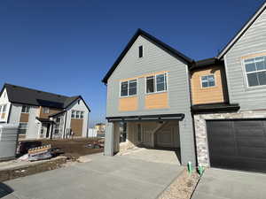 View of front facade featuring driveway