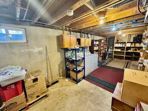 Below grade area featuring washing machine and dryer