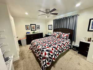 Bedroom featuring light carpet, recessed lighting, and a ceiling fan