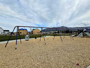 Community jungle gym featuring a residential view