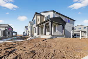 View of front of house featuring a porch and a residential view