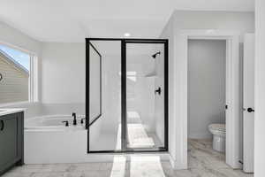 Full bath with light marble finish floors, a shower stall, a bath, vanity, and recessed lighting