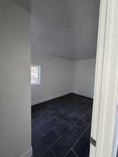 Bonus room featuring baseboards