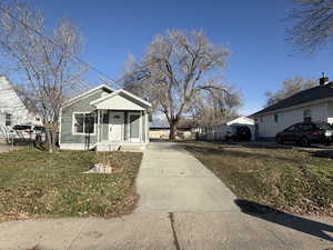 Bungalow-style house with a front yard and driveway