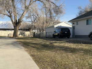 View of yard with an outbuilding