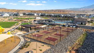 Aerial perspective of suburban area featuring a mountainous background
