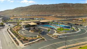 Aerial view of a mountain backdrop and a pool