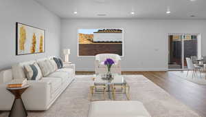 Living room with recessed lighting and wood finished floors