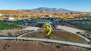 Aerial view of residential area featuring a park and mountains