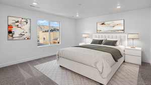 Carpeted bedroom featuring recessed lighting and a mountain view