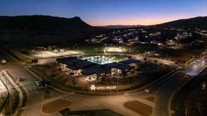View of property location featuring a mountain backdrop and a pool area