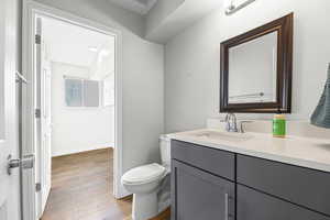 Bathroom featuring vanity and light wood-style flooring