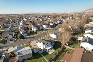 Aerial view of property's location with nearby suburban area