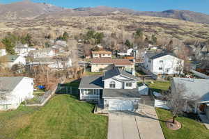 Aerial view of residential area featuring a mountainous background