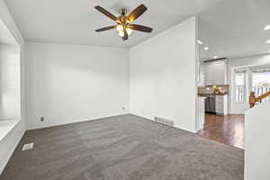 Empty room with carpet, recessed lighting, and ceiling fan