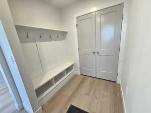 Mudroom with light wood-style floors