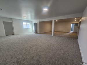Below grade area with baseboards and carpet floors