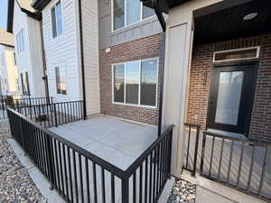 Entrance to property with brick siding