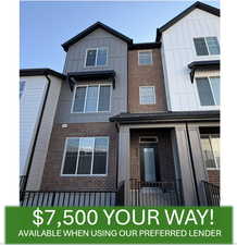View of front of home featuring board and batten siding and brick siding
