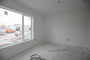 Unfurnished room featuring concrete floors