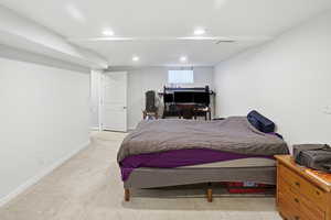 Carpeted bedroom with baseboards