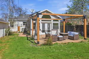 Rear view of property featuring a fenced backyard, french doors, outdoor seating, and a patio area