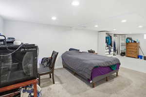 Carpeted bedroom featuring recessed lighting