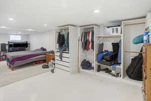 Bedroom featuring a closet, carpet, and recessed lighting